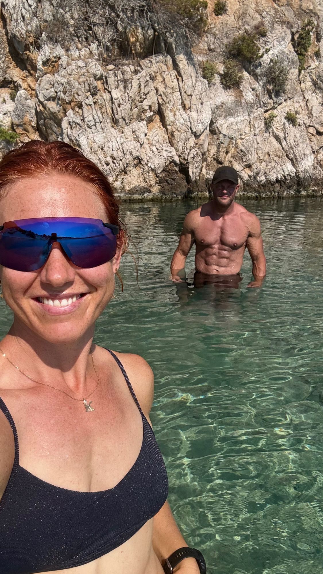 Selfie in the clear shallow water by the rocks at Voidokilia